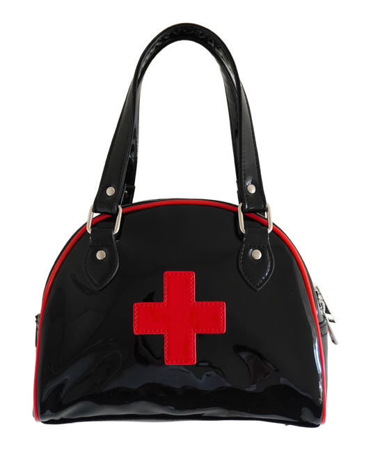 A glossy black patent leather handbag with a red cross on the front, red piping along the edges, and black shoulder straps with silver metal hardware, shown against a plain white background.